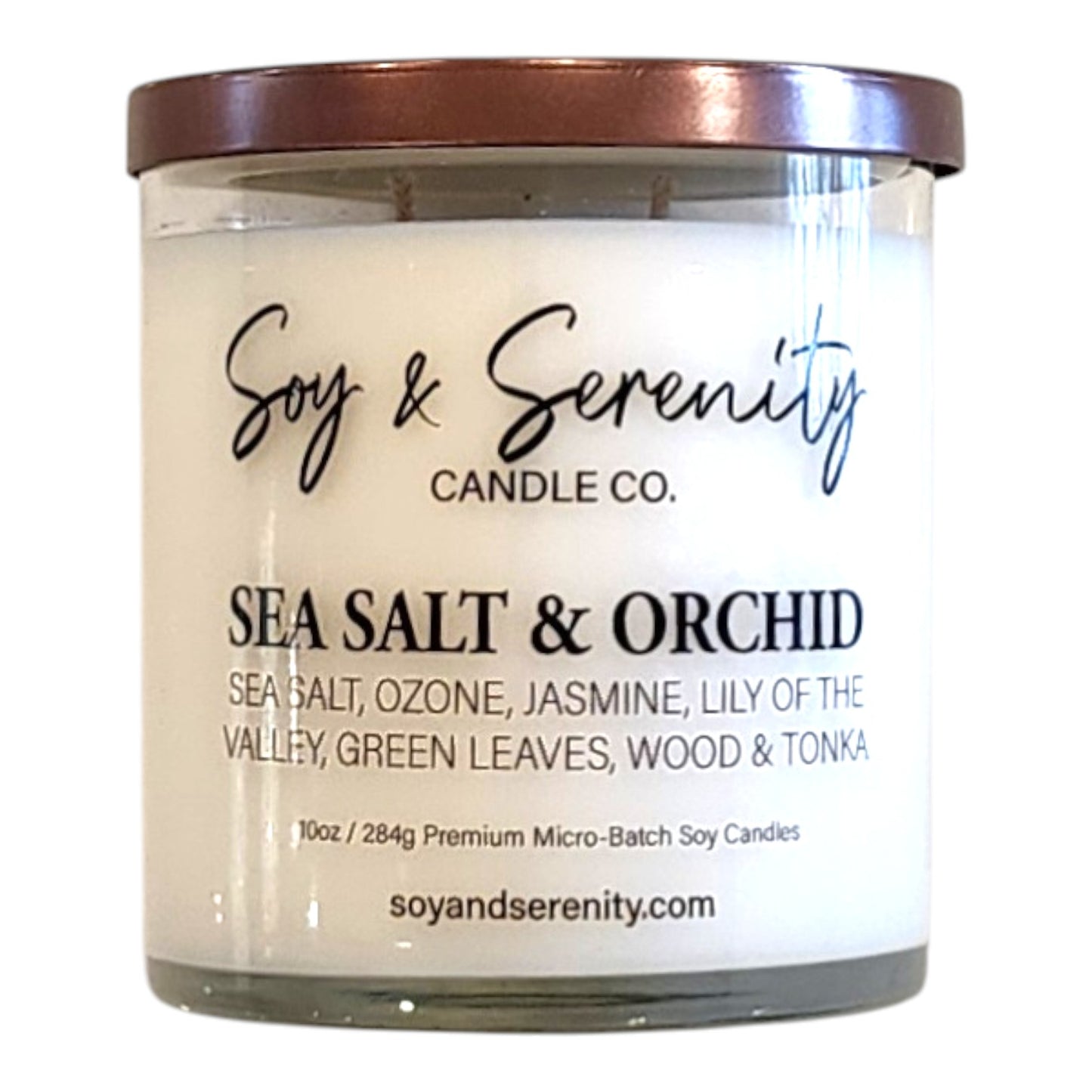 Sea Salt & Orchid soy candle with sea salt, orchid, freesia, and amber notes on a white background.