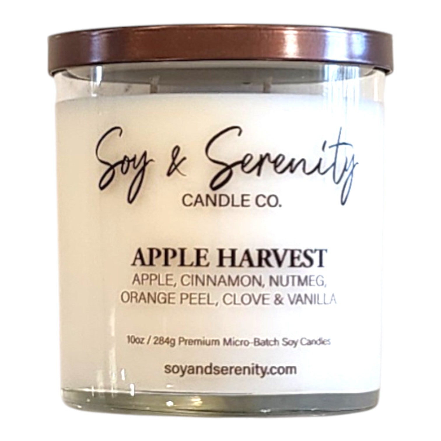 Apple Harvest apple cinnamon soy candle in a clear glass jar on a white background.