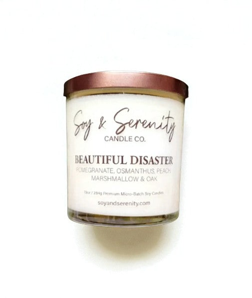 Beautiful Disaster is a candle that captures contradiction in the best way — both daring and soft, playful and comforting. Bright pomegranate, ripe peach, and crisp apple create a juicy, mouthwatering opening. Just as the fruit notes bloom, they’re wrapped in the gentle sweetness of velvety marshmallow, giving this fragrance its irresistible charm. Infused with essential oils of pomegranate, osmanthus, peach, and oak, this hand-poured soy candle brings warmth and a touch of intrigue to any space. 