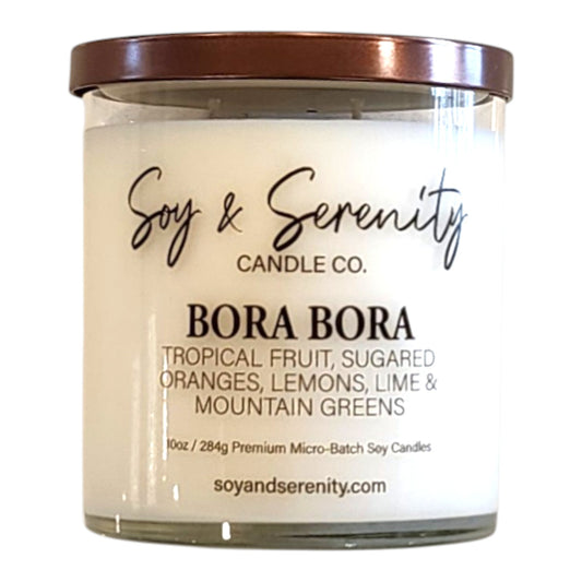 Bora Bora beach candle in a clear glass jar on a white background, tropical soy candle with a hint of coconut breeze.