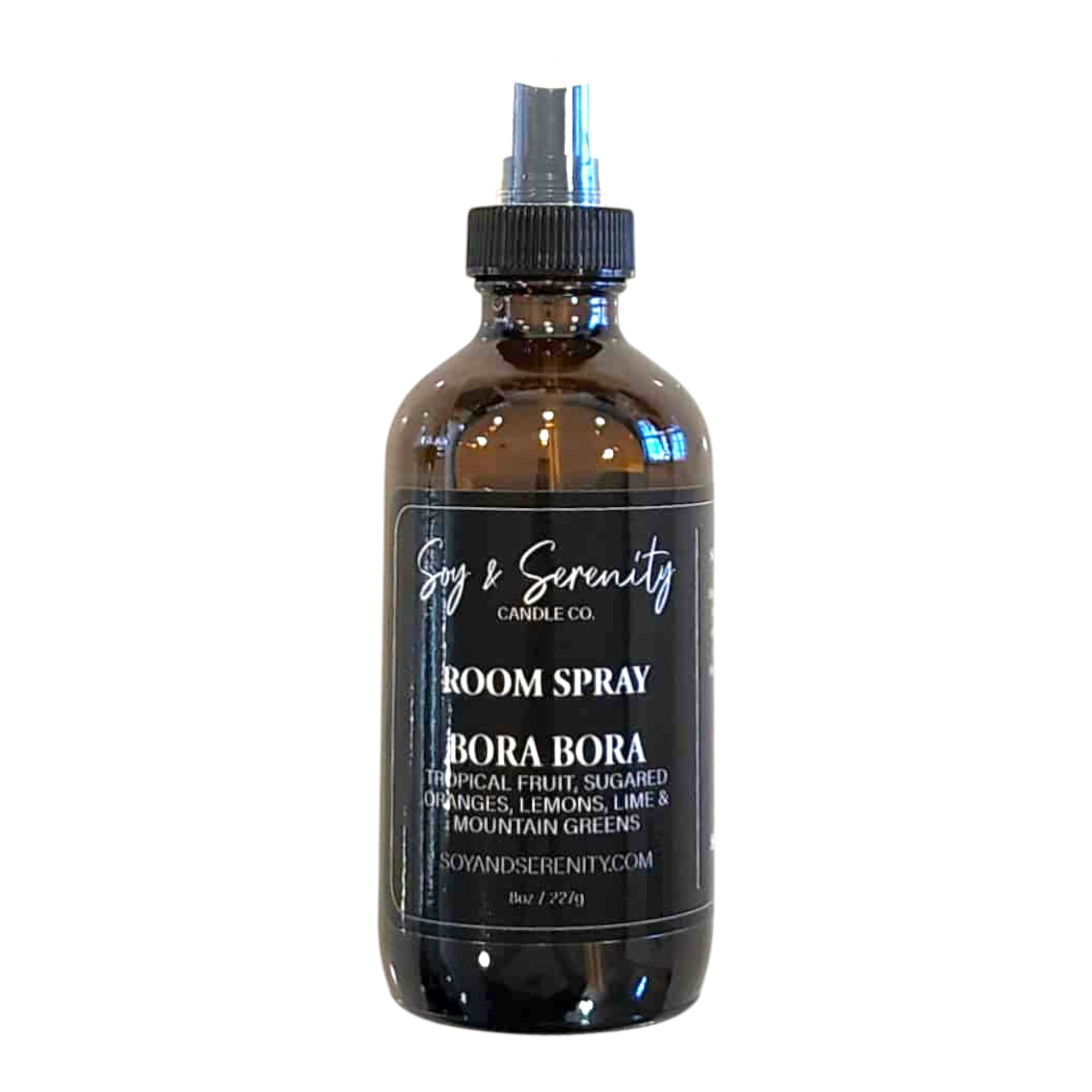 Room spray with tropical fruits, citrus, and mountain greens — fresh beachy air freshener on white background.