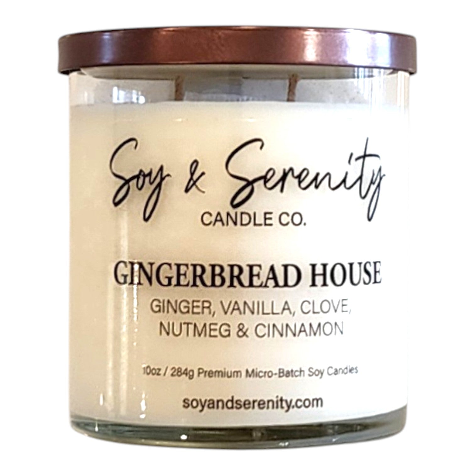 Gingerbread House bakery soy candle in a clear glass jar on a white background, gingerbread candle.