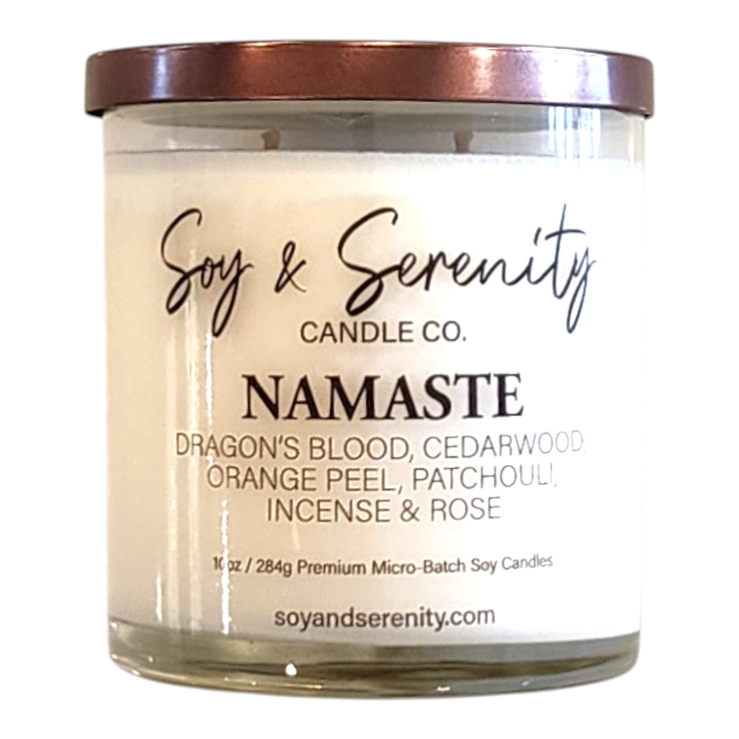 Namaste dragons blood soy candle with cedarwood and patchouli notes on a white background, spiritual candle.