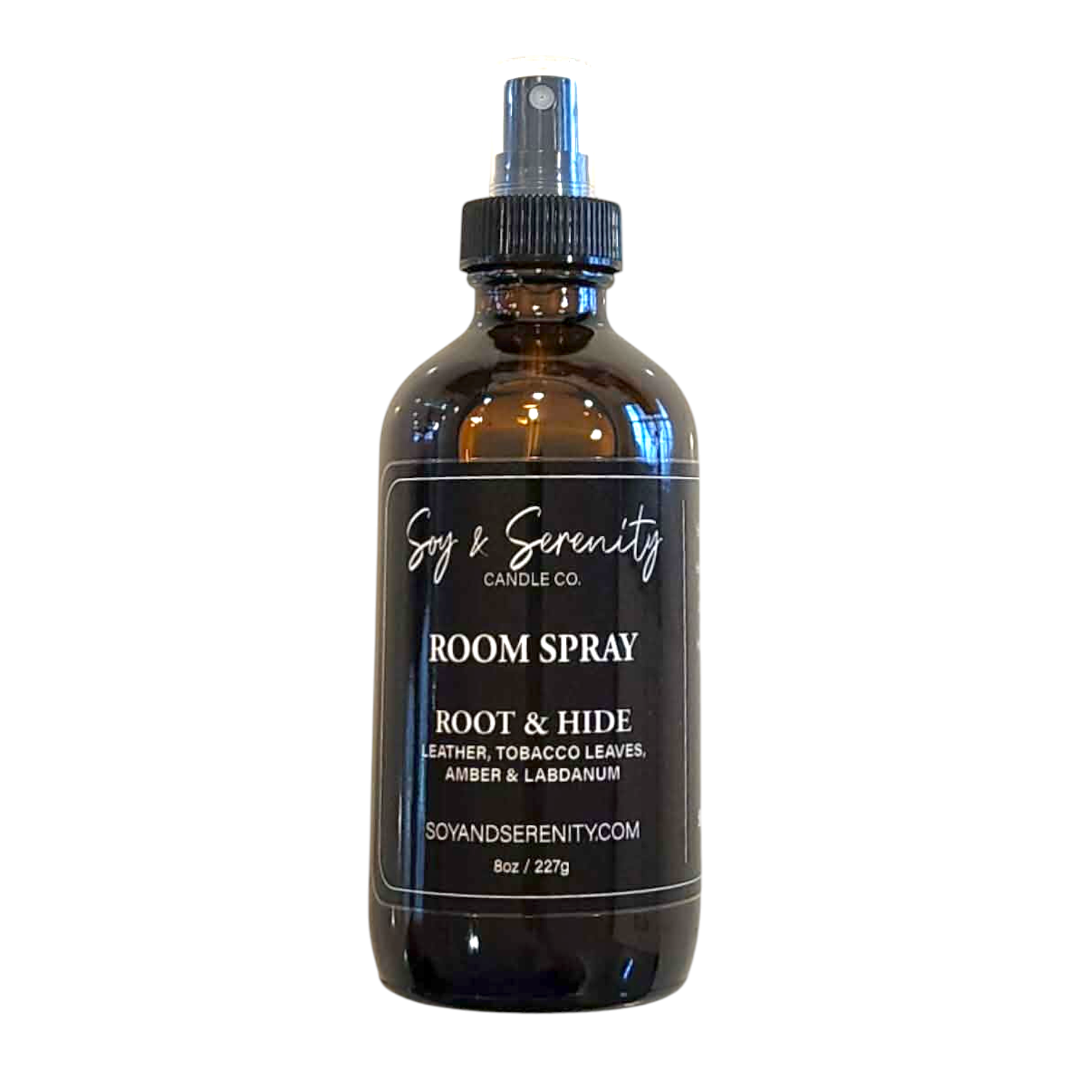Room spray with leather, tobacco leaves, amber, and labdanum notes on a white background, clean masculine home fragrance.