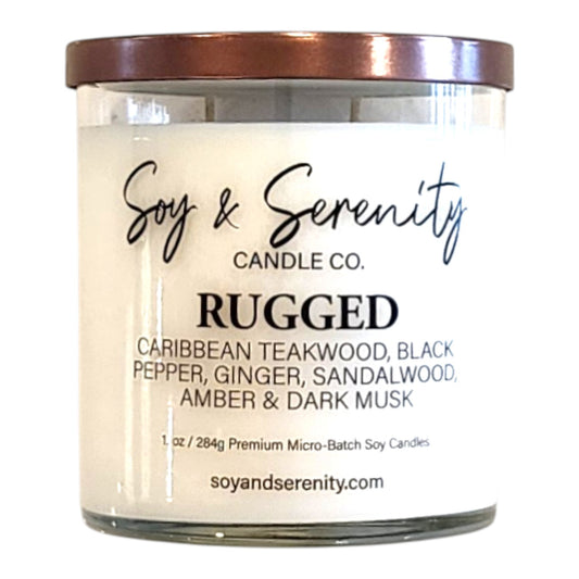 Rugged tobacco soy candle with sandalwood, teakwood, amber, and dark musk notes on a white background.