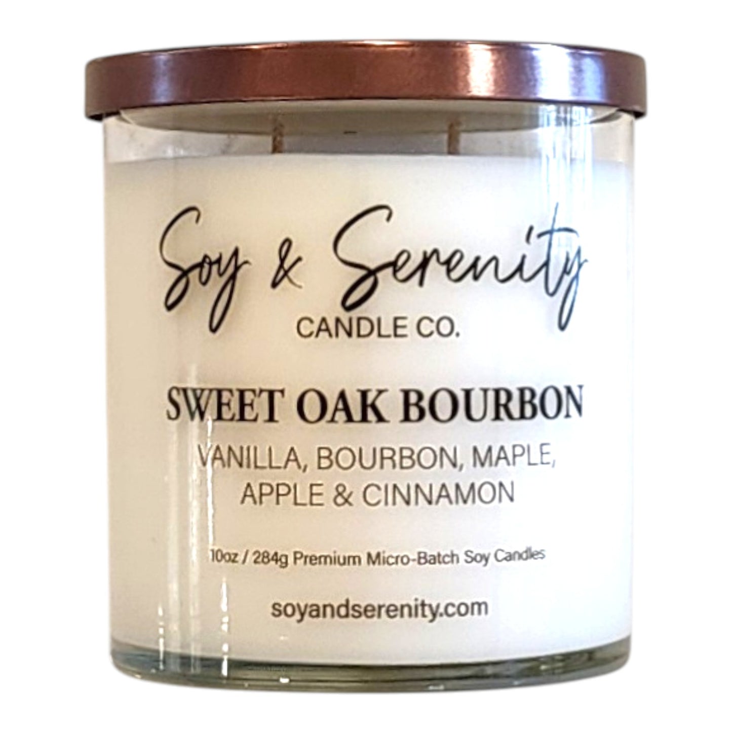Sweet Oak Bourbon soy candle with bourbon, maple, vanilla, and cinnamon leaf notes on a white background.